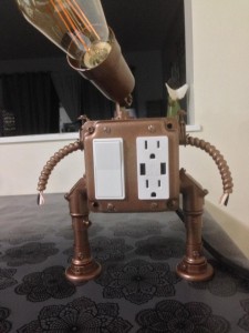 A vintage Edison light with usb and electrical outlet.